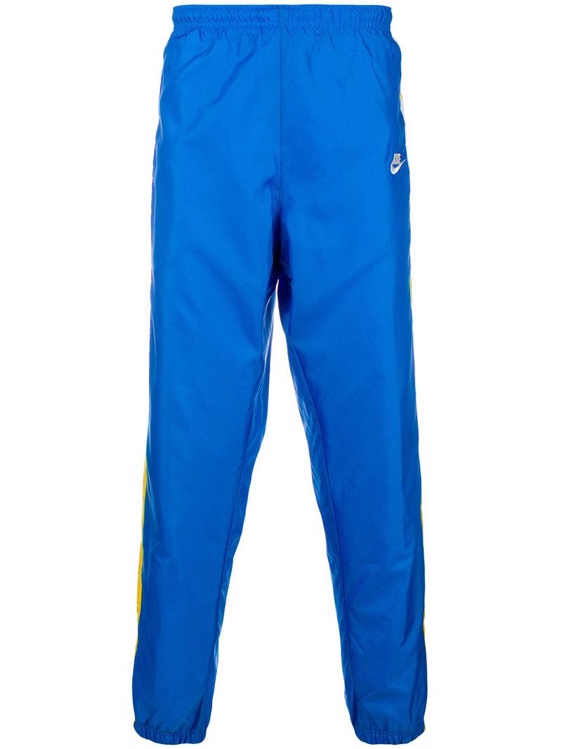nike windrunner pants blue, Off 66%, www.scrimaglio.com