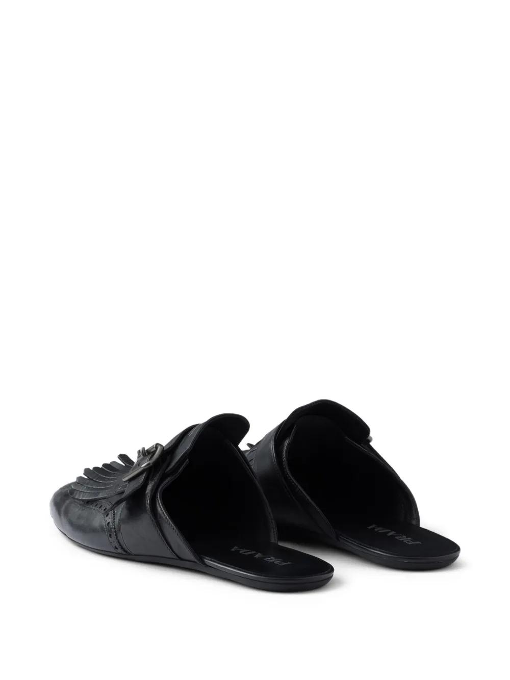 Prada Shuffle Antiqued Leather Mules With Buckled Strap And Fringe