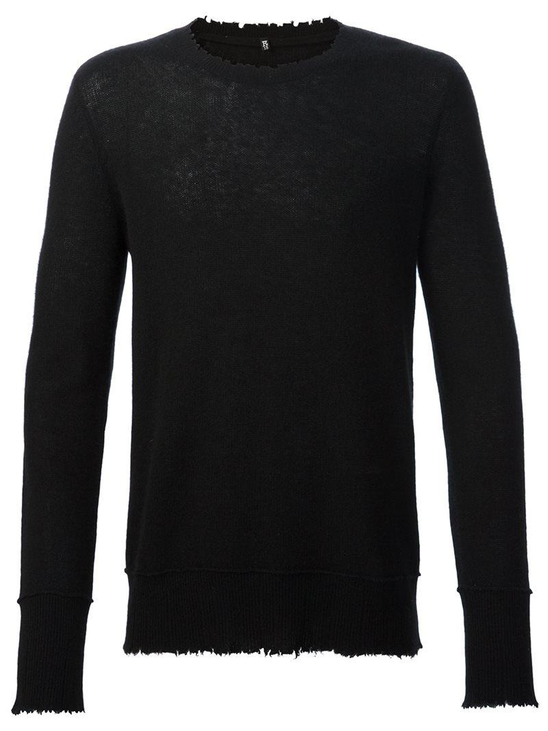 frayed black sweater