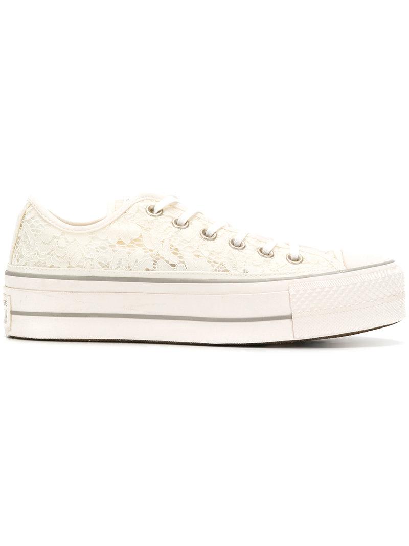 white embroidered converse