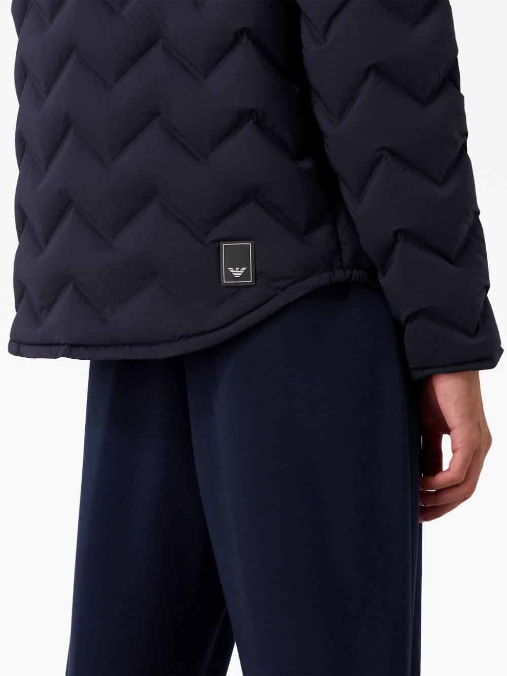 Water-repellent quilted down jacket in light wool with sailing