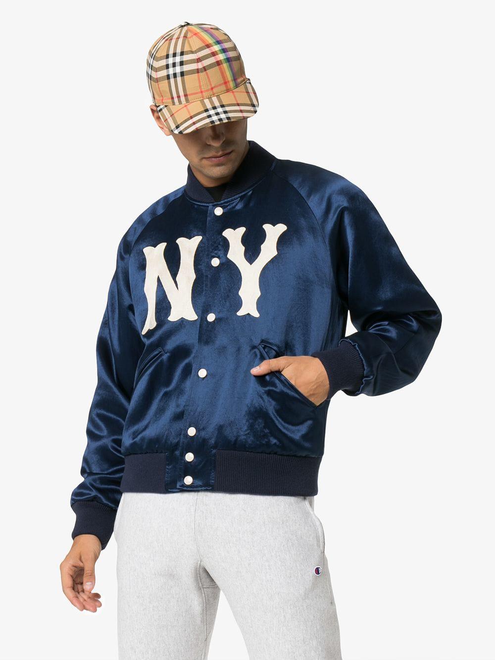 Shop the Men's jacket with NY Yankees™ patch by Gucci. A blue