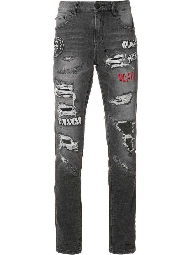 ripped jeans with black patches