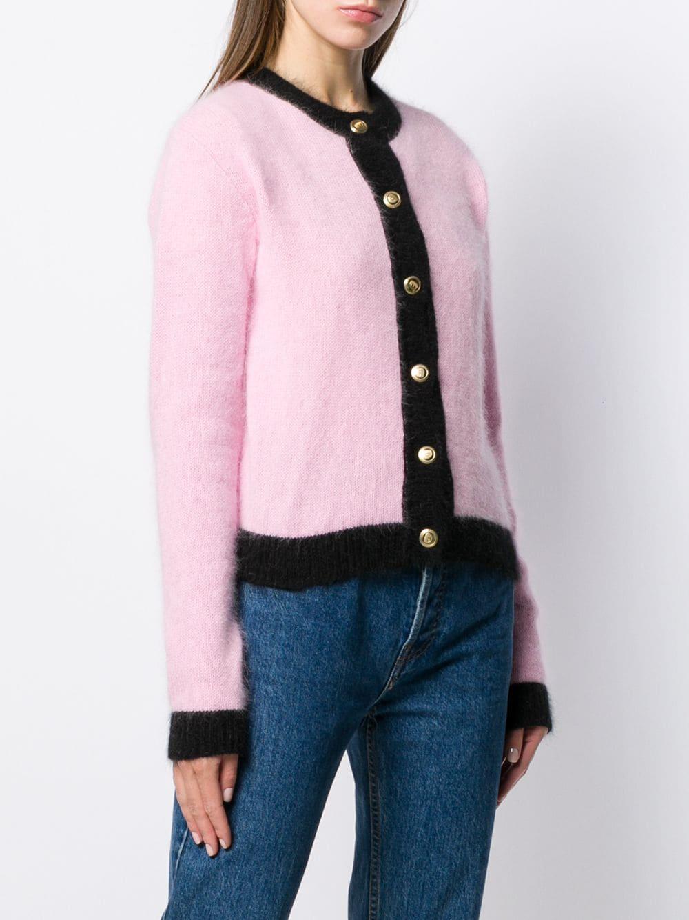 pink cardigan with black trim