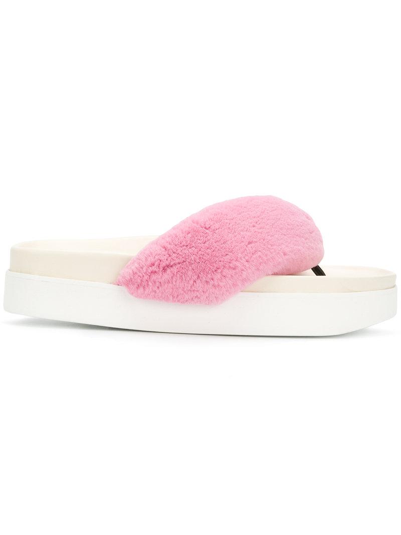 pink fuzzy flip flops