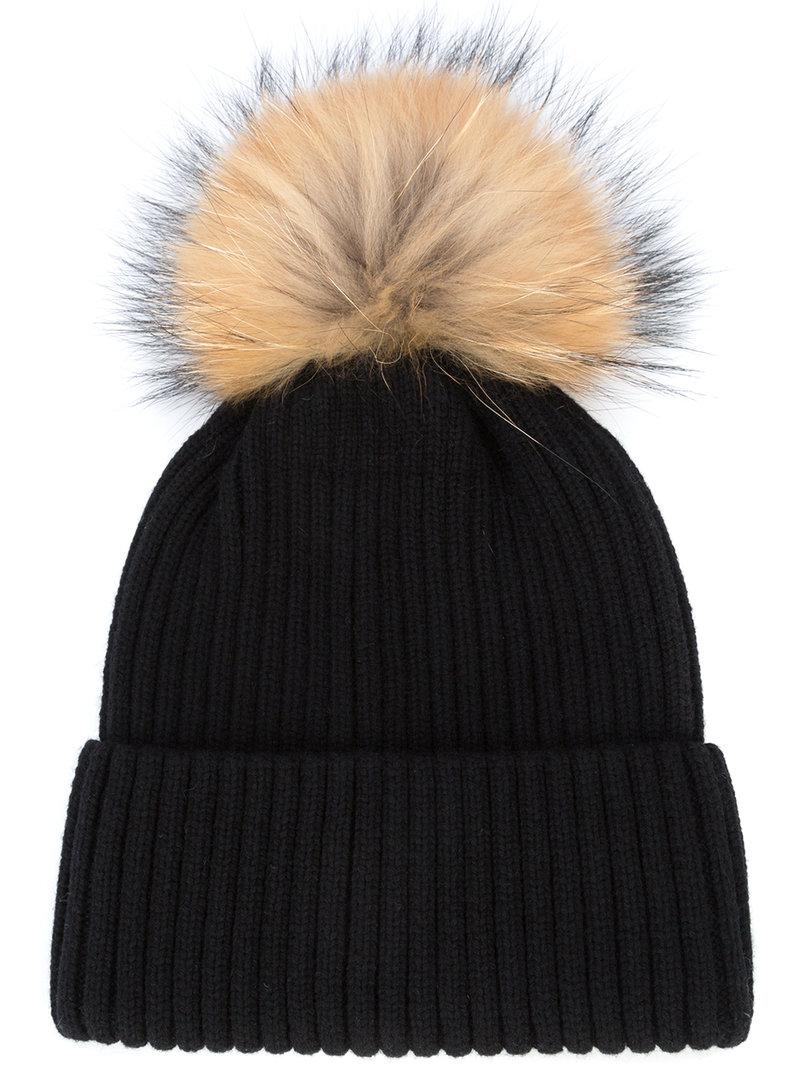 black hat with brown pom pom