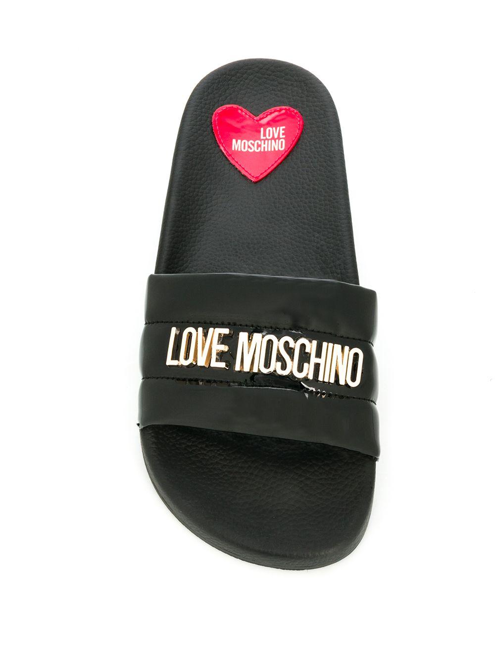 moschino monogram leather slides