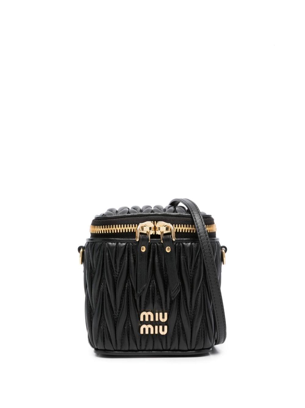 Buy Miu Miu Black Small Matelassé Top Handle Bag in Leather for
