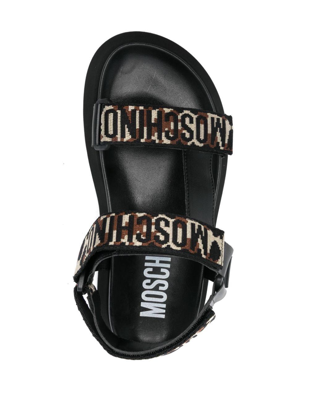 Moschino レディース ブラック ロゴストラップ サンダル フラットシューズ
