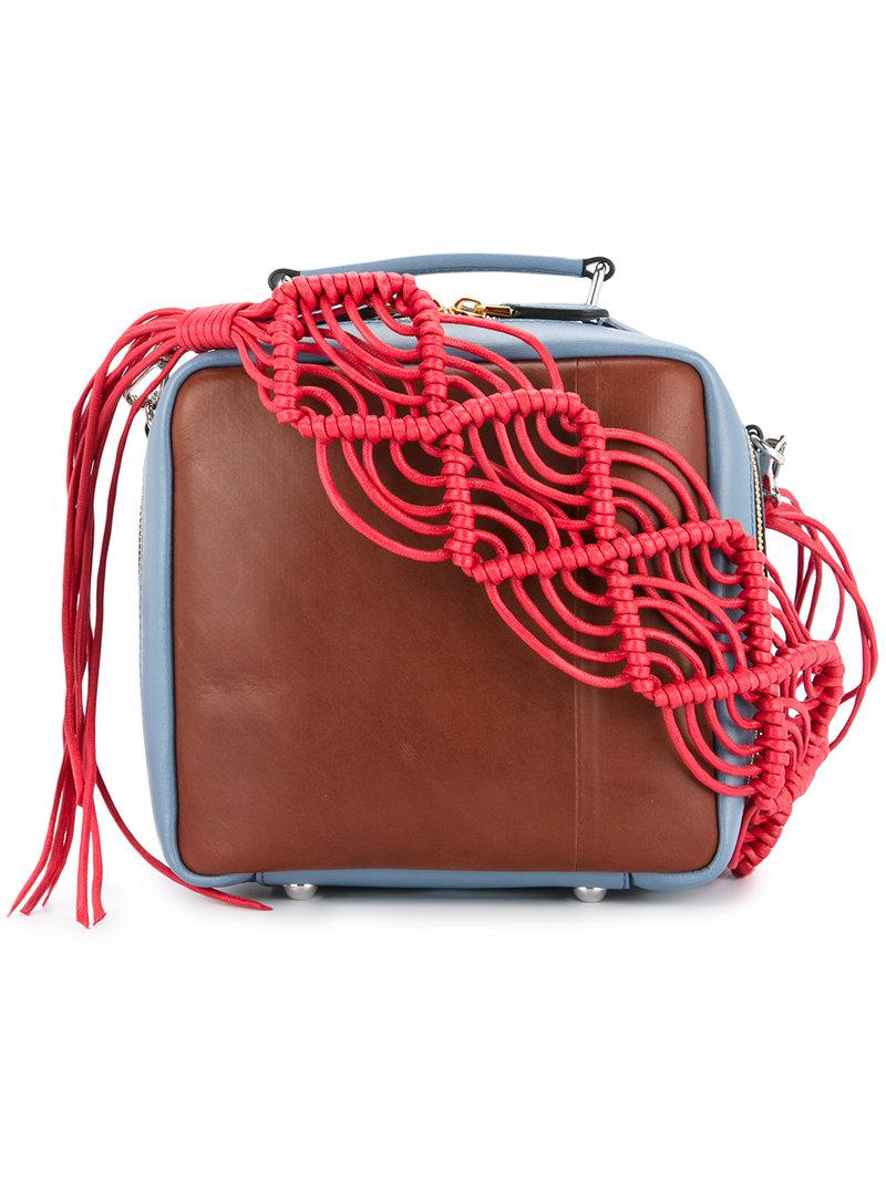 blue bag brown straps