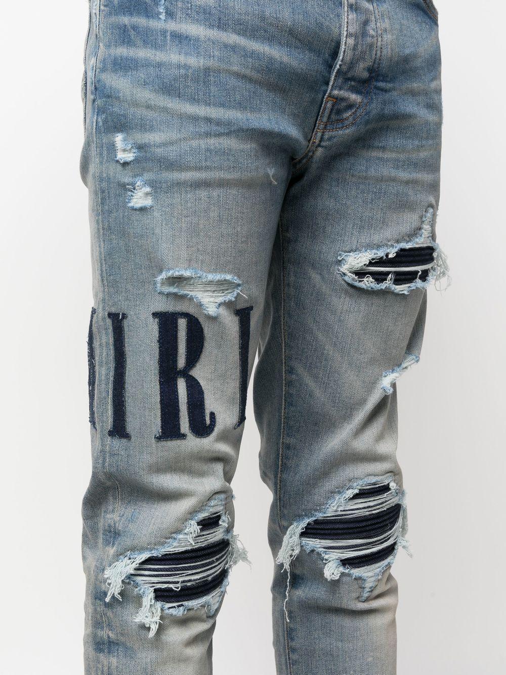 Amiri Appliqué-logo Distressed Jeans in Blue for Men | Lyst