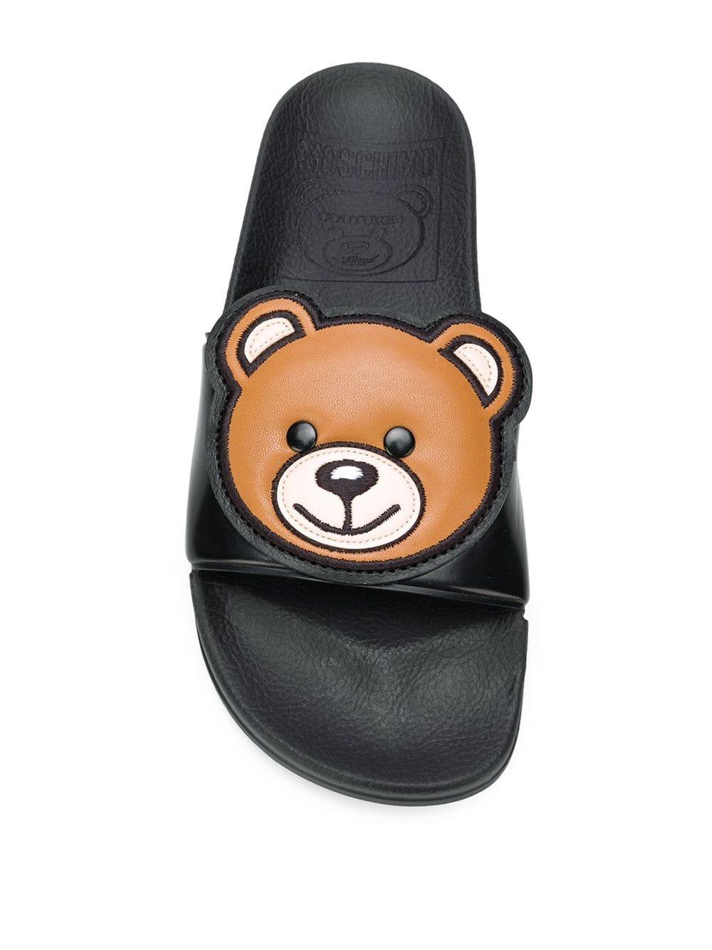 moschino monogram leather slides