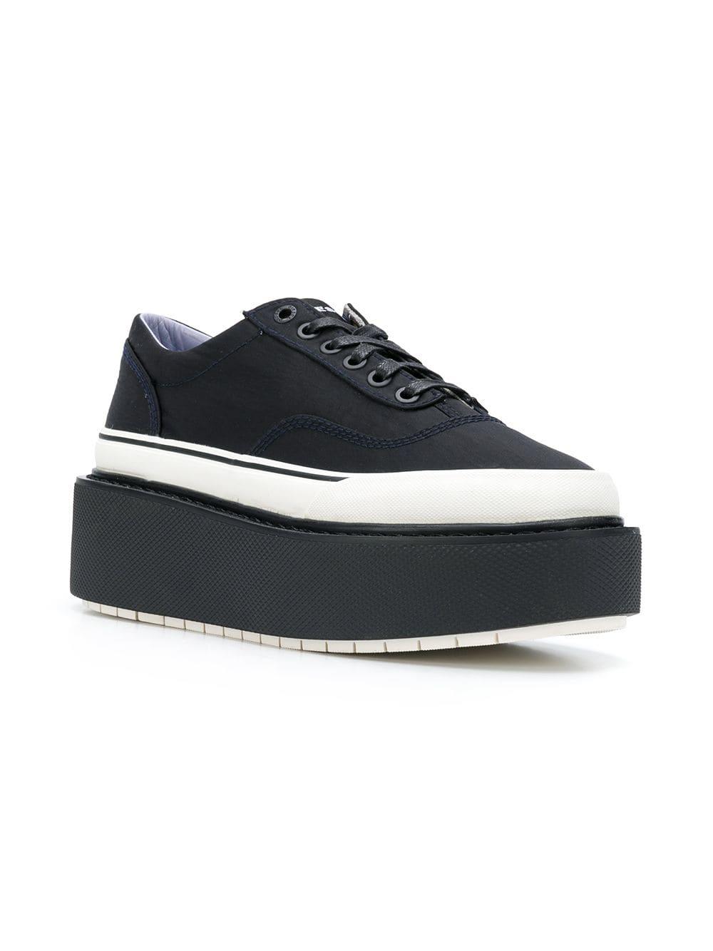 black platform trainers