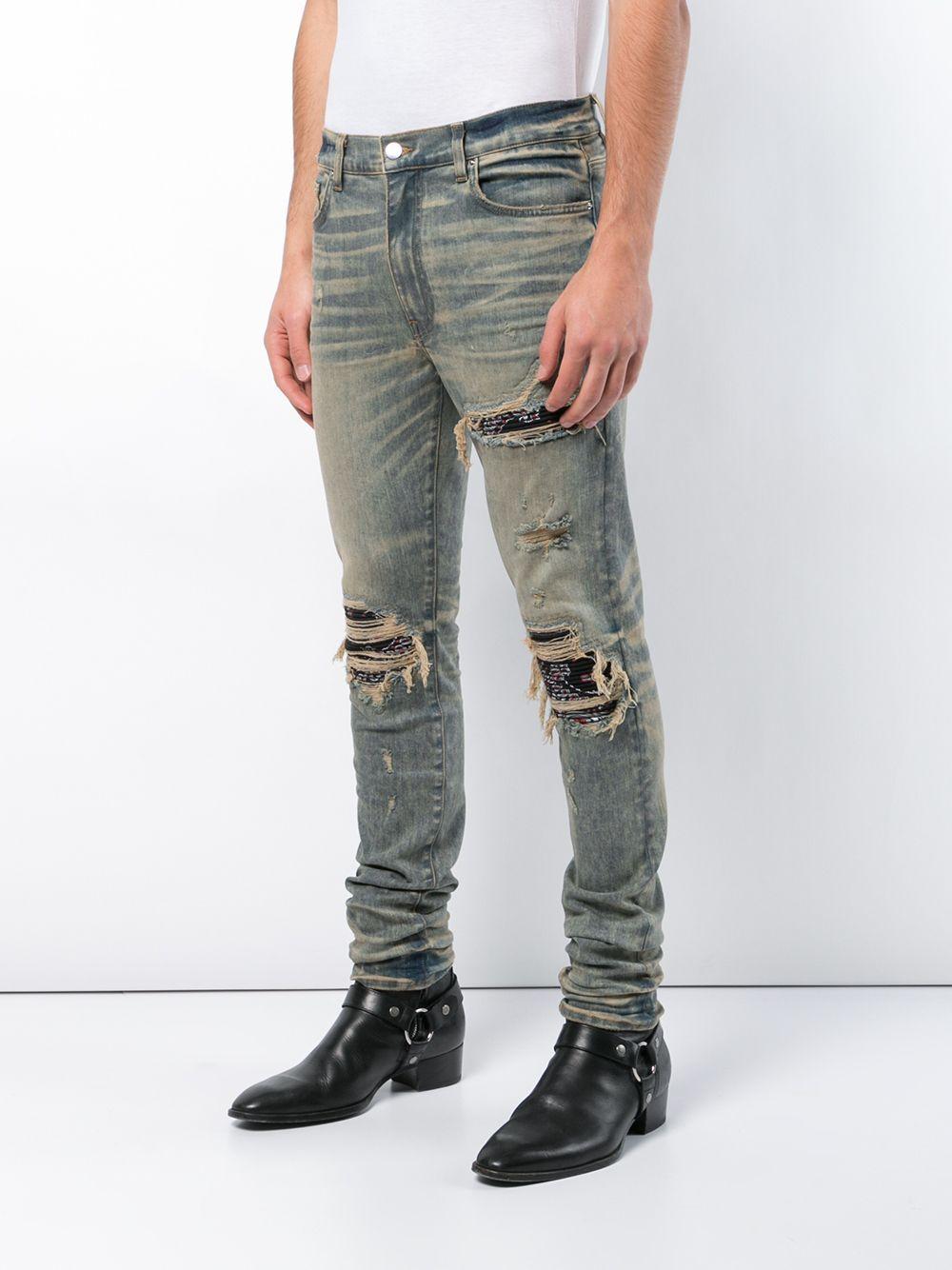 ripped jeans with bandana patches
