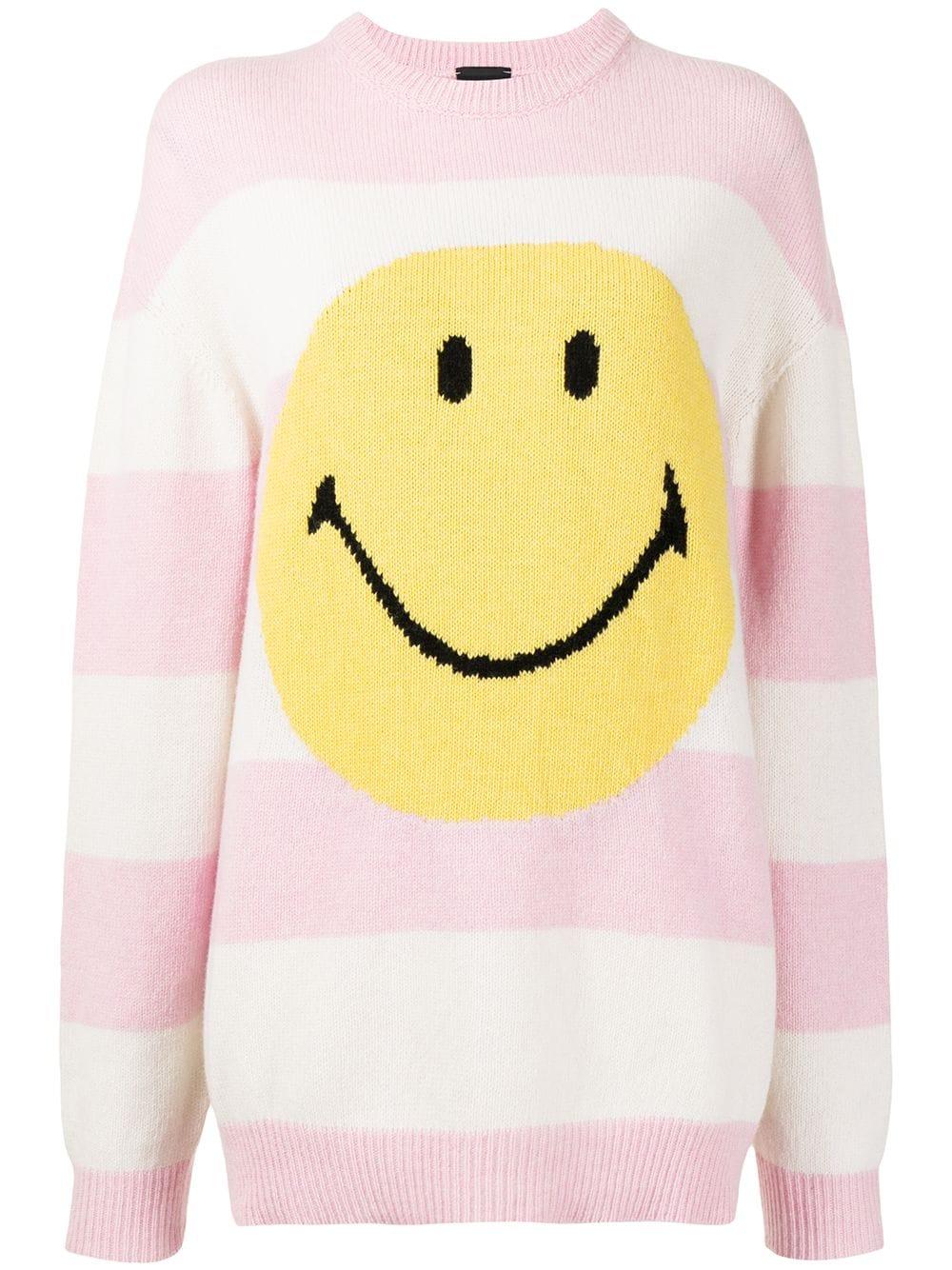 pink jumper with red smiley faces