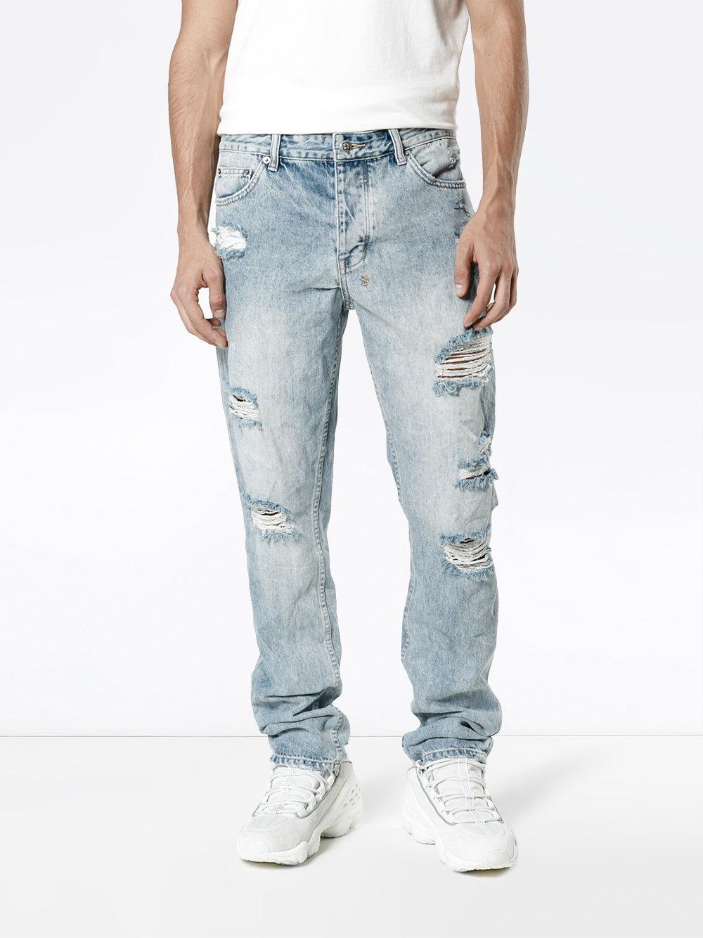 travis scott ripped jeans