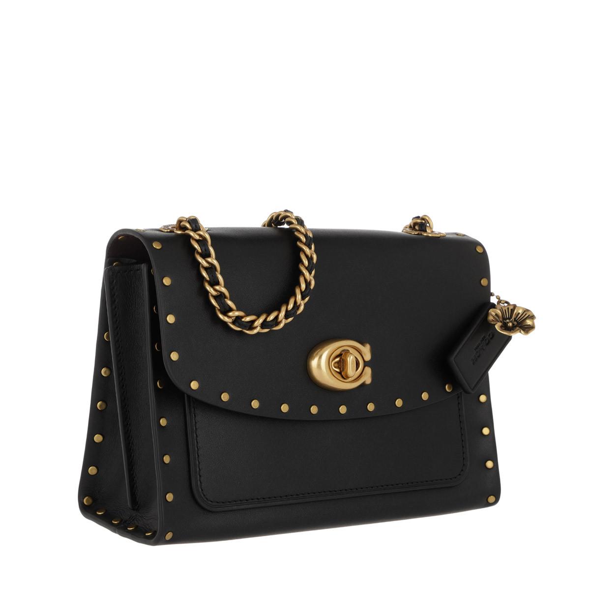 coach border rivets parker 18 shoulder bolsa