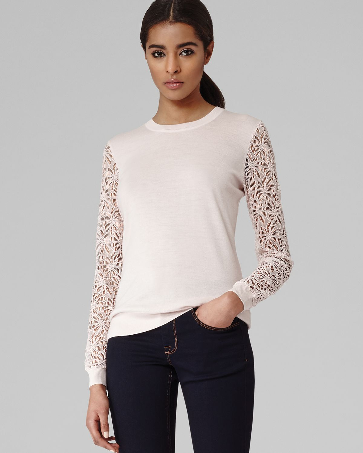white sweater with lace sleeves