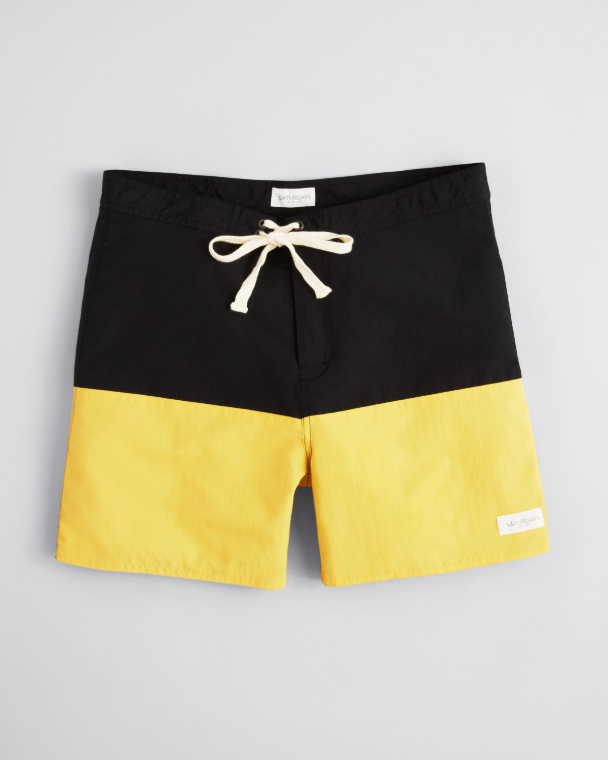 black and yellow swim trunks