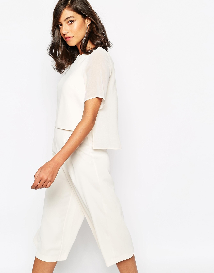 cream jumpsuit with cape