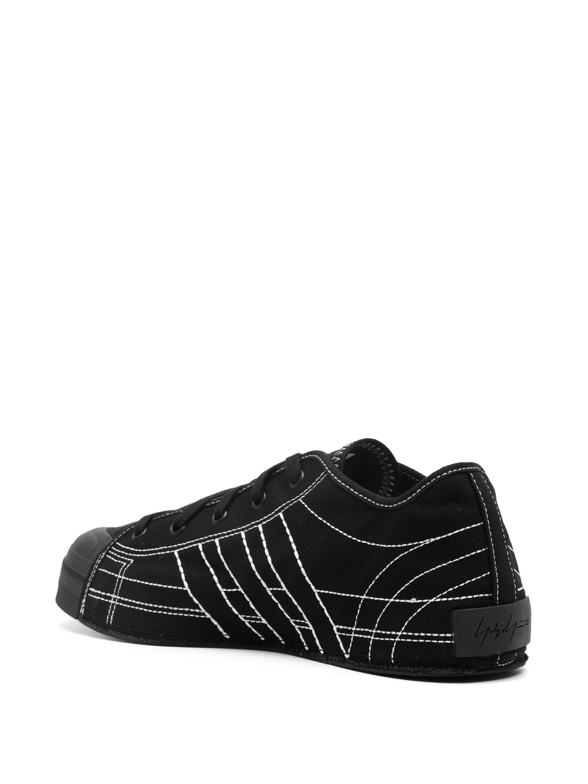 Black and white adidas nizza lo trainers sale