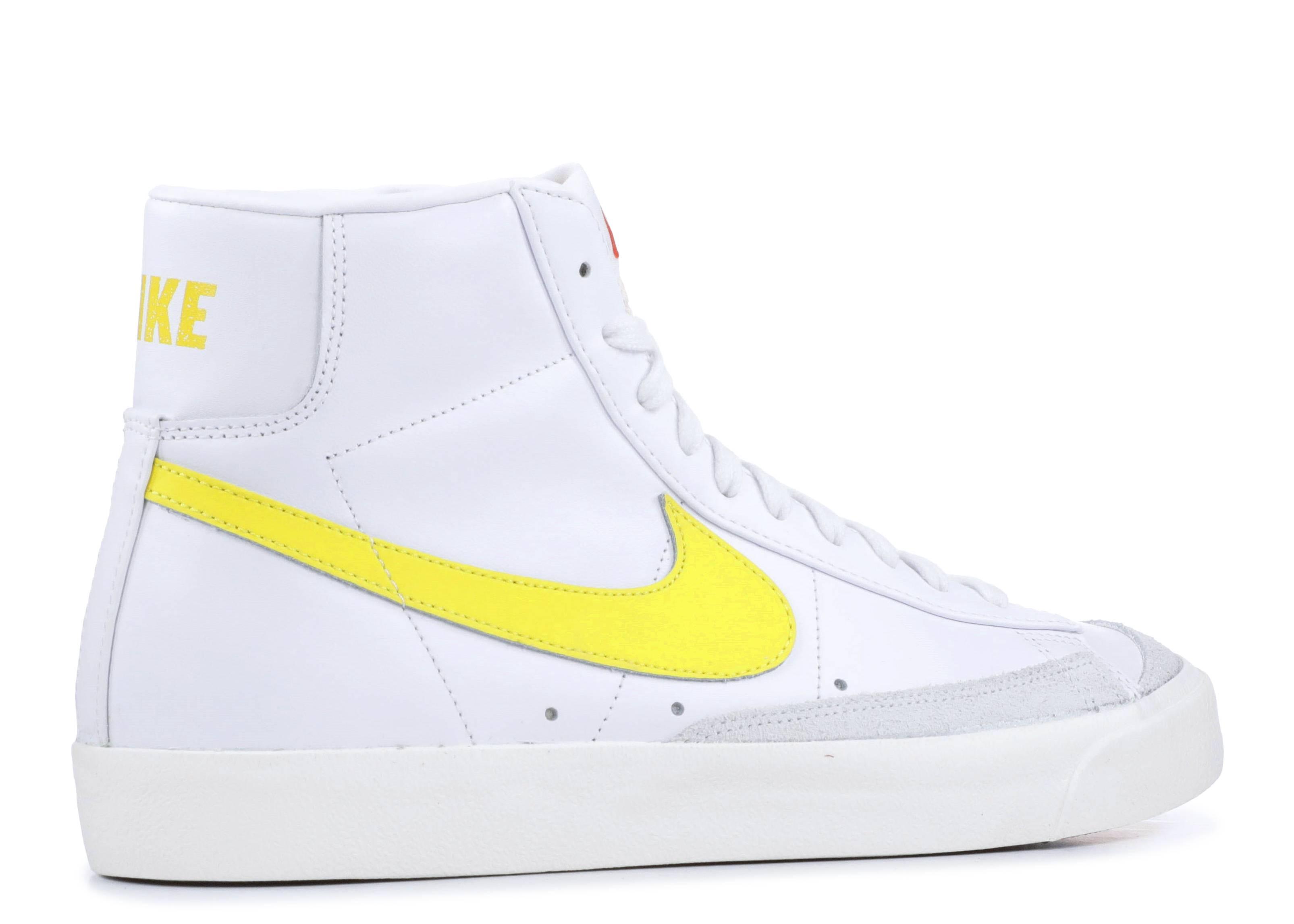 white and yellow nike blazers