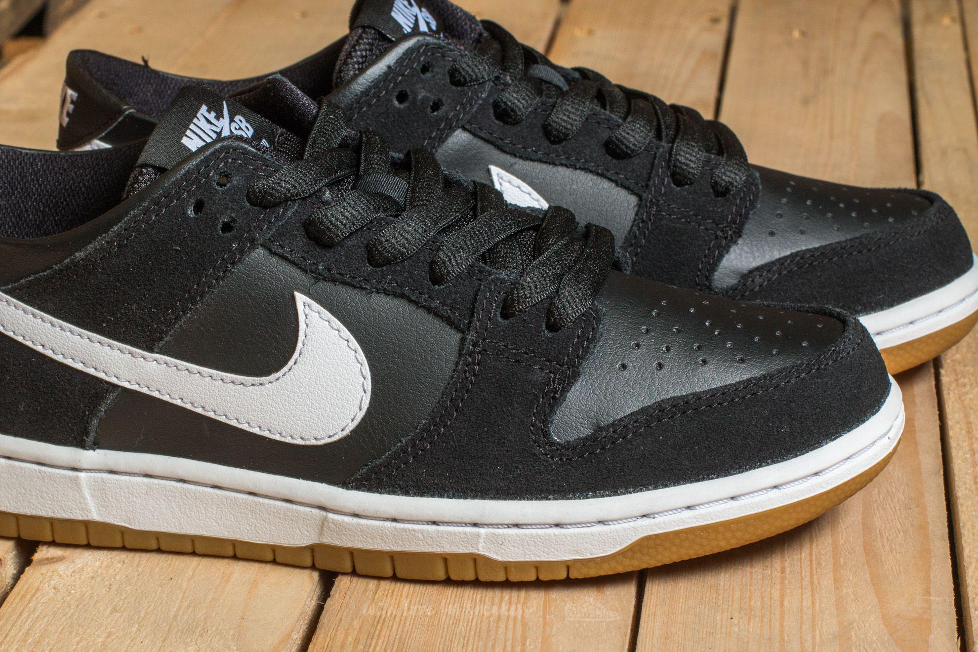 nike dunk low black white gum