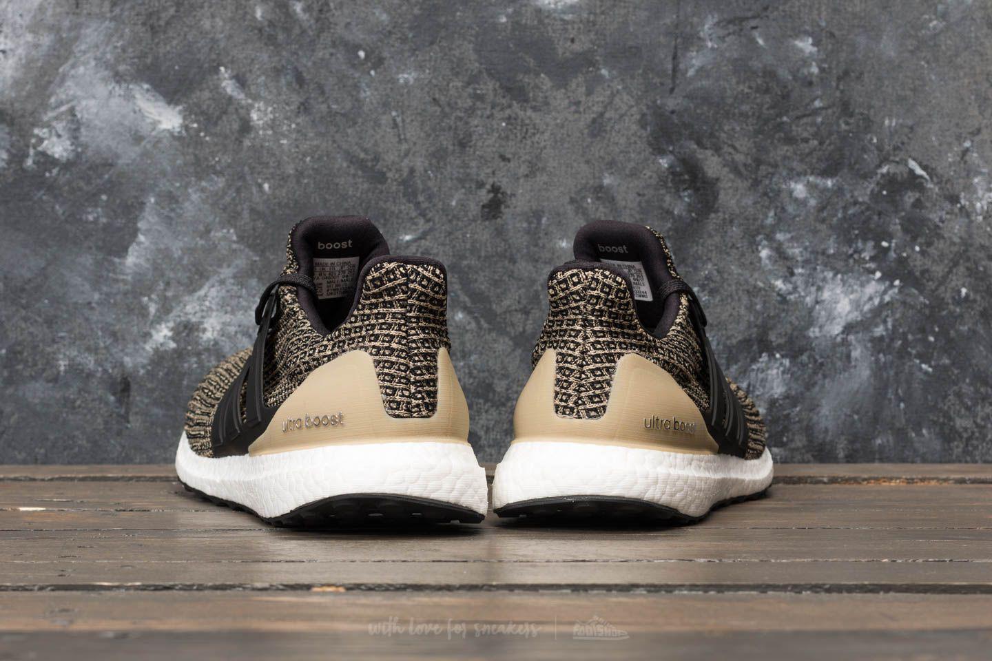 ultra boost black raw gold