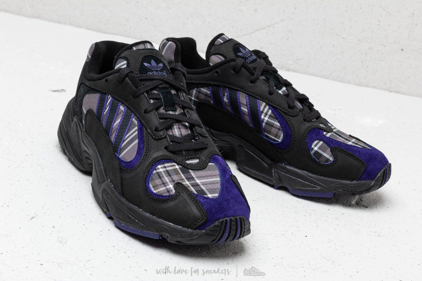 blue and black adidas yung 1
