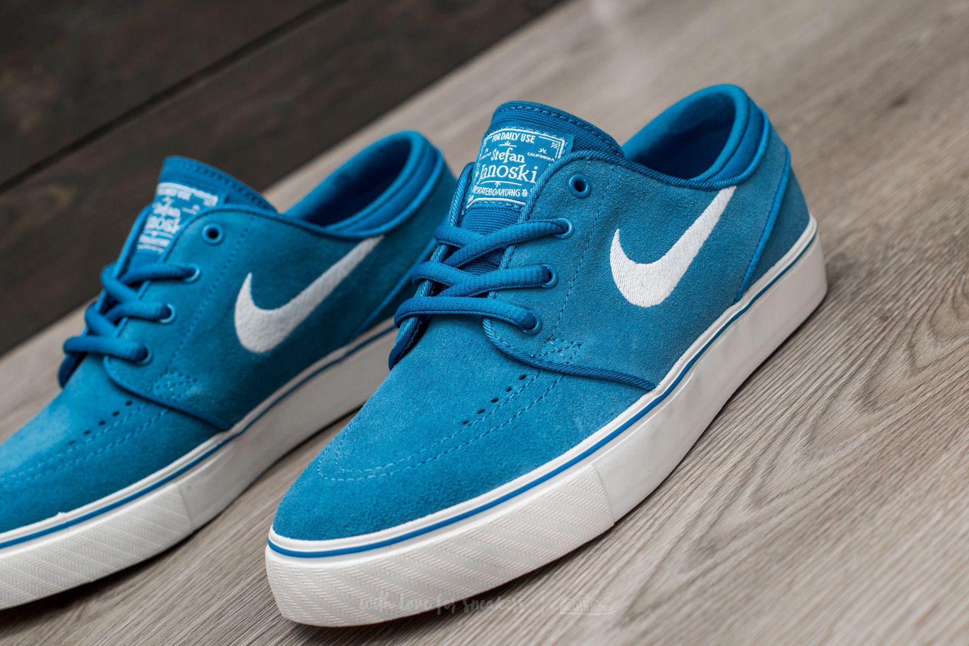 white and blue janoskis