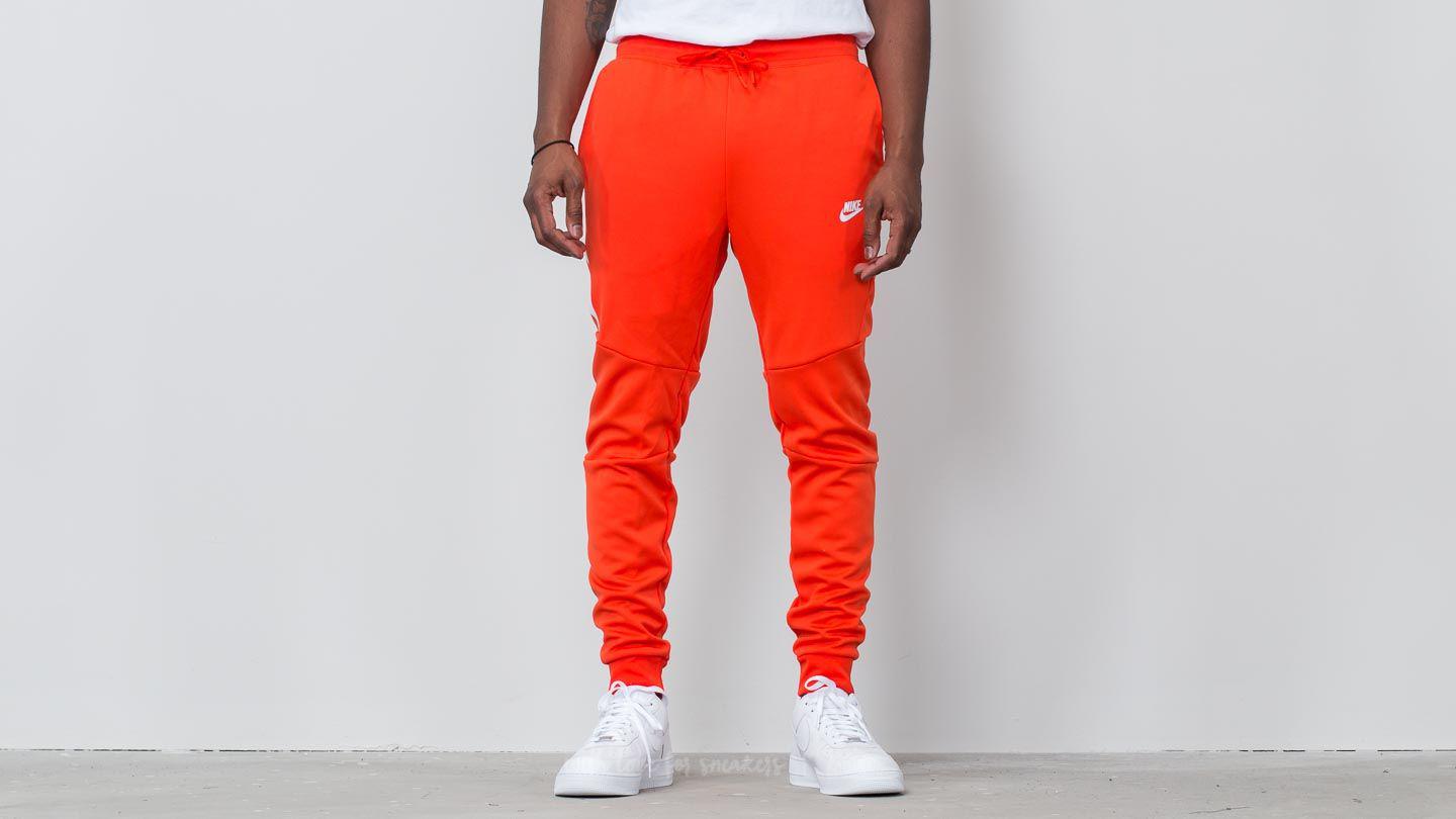 orange nike tech pants