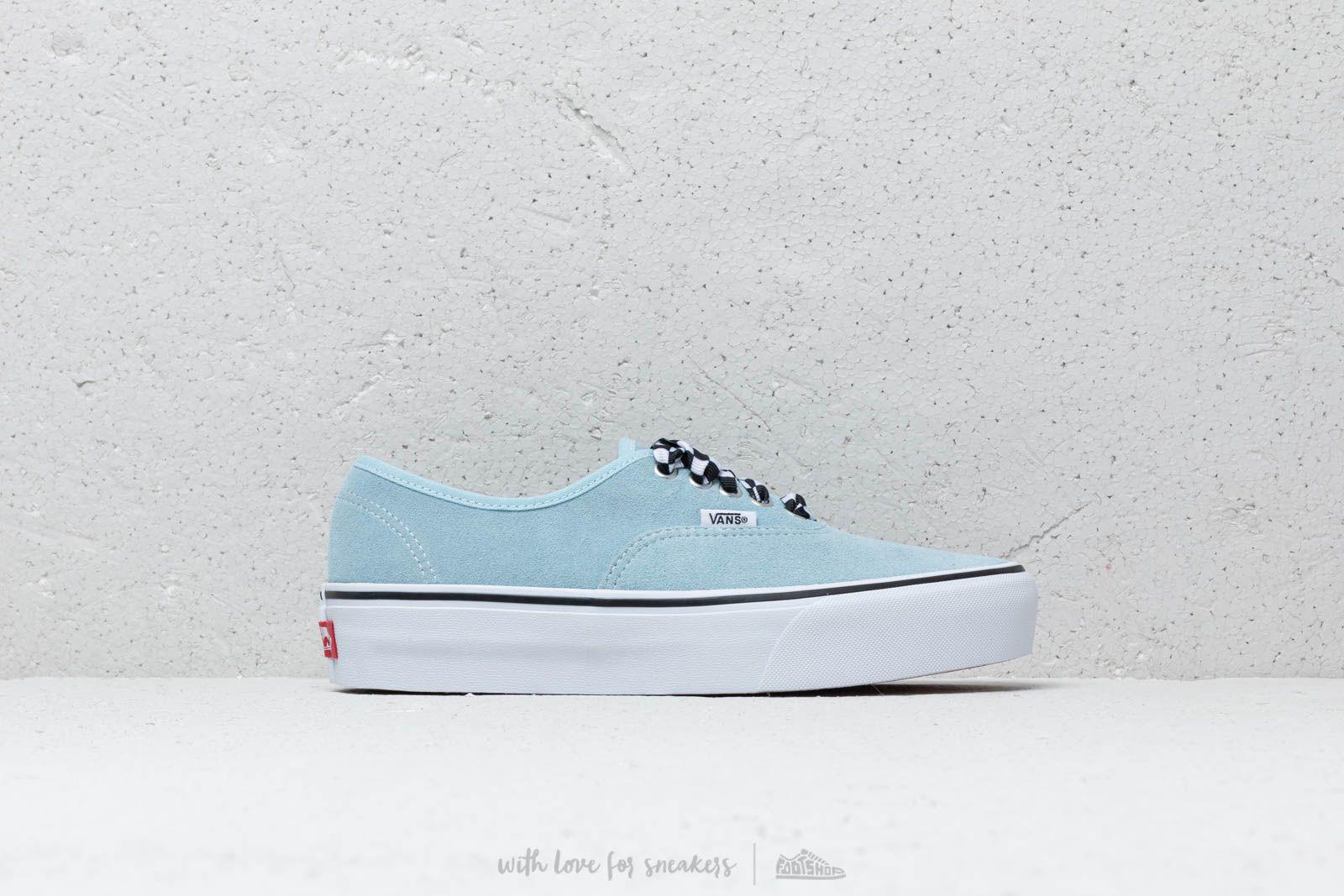 gray vans with blue laces