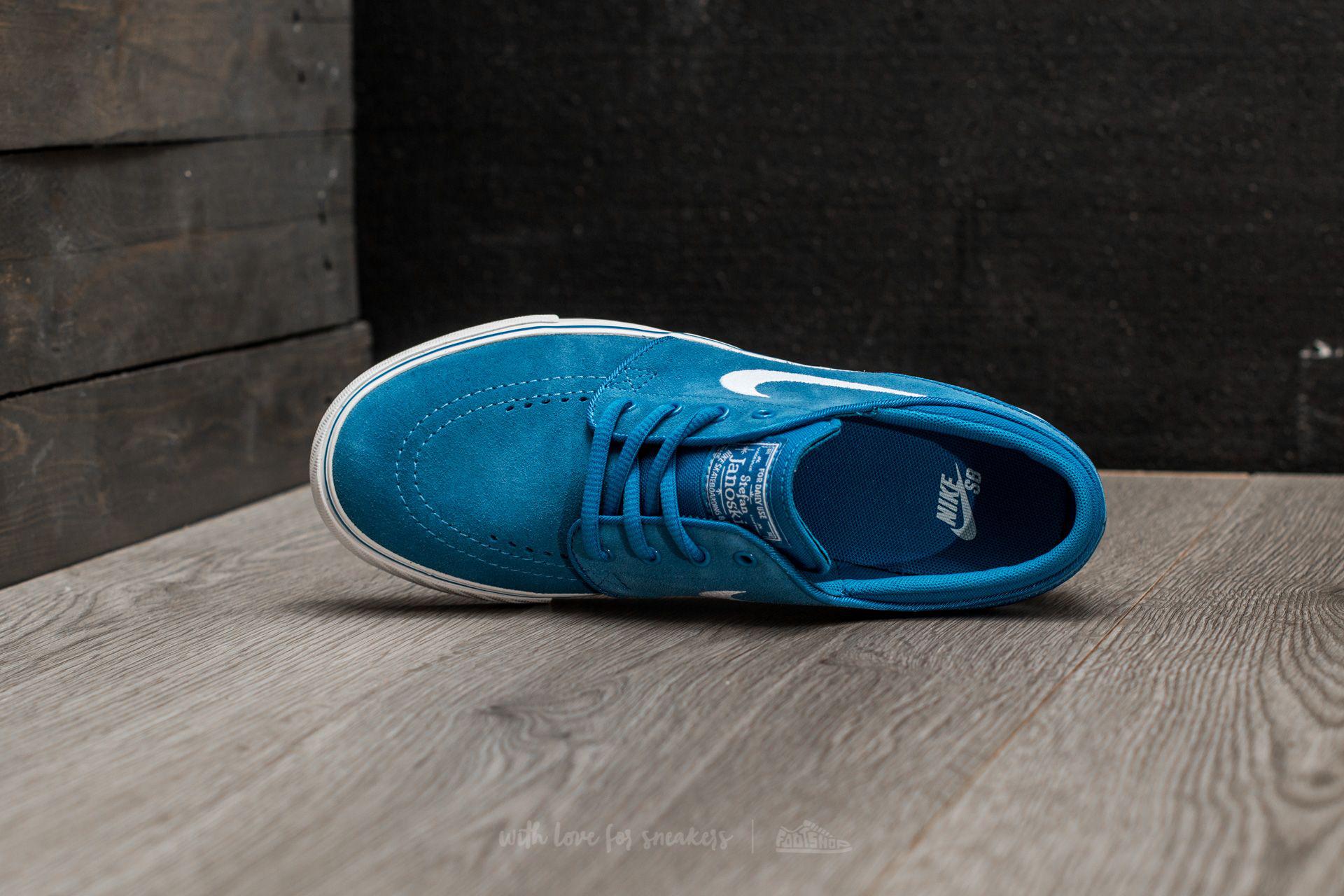 white and blue janoskis