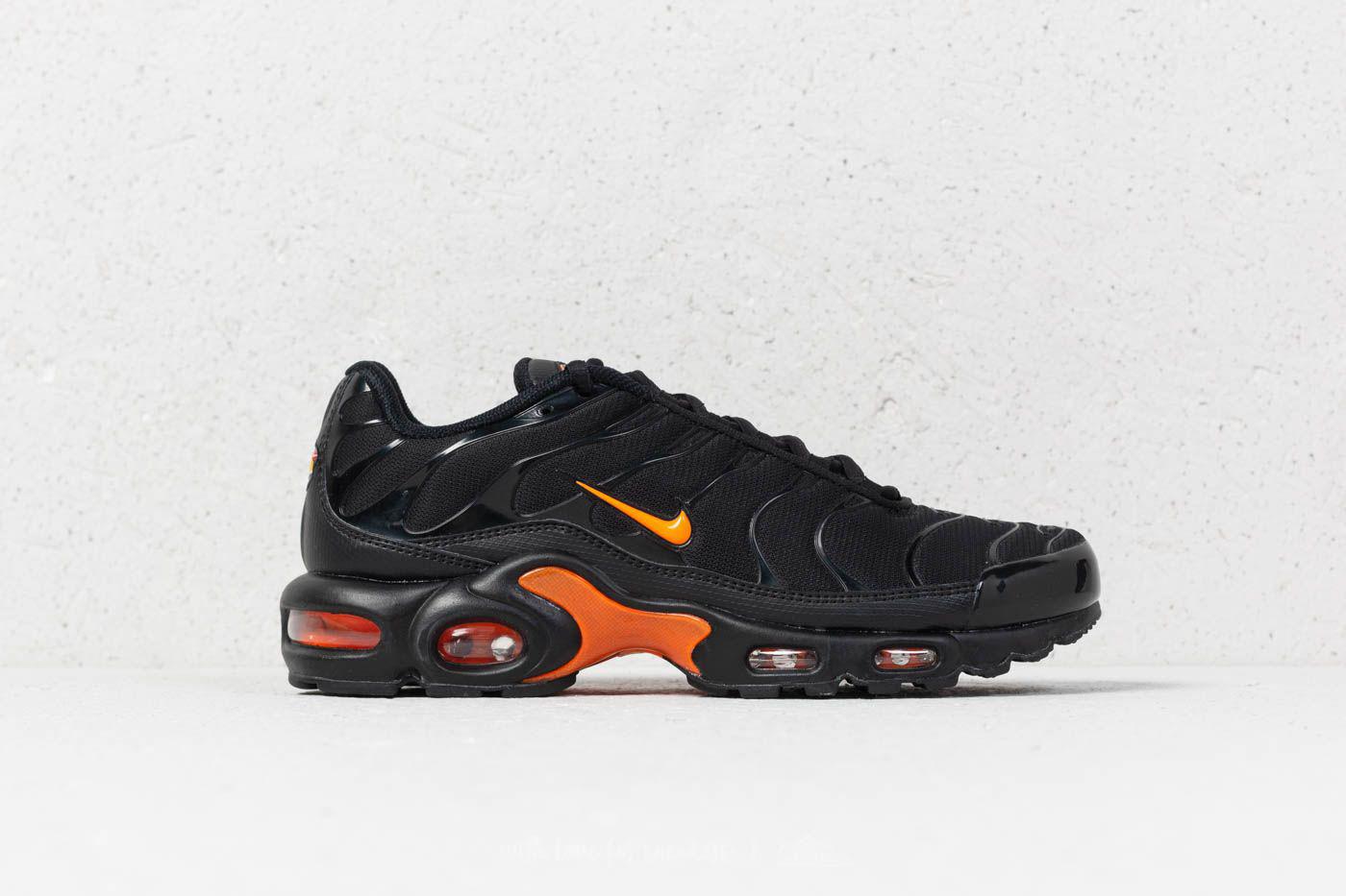 white tns with orange tick