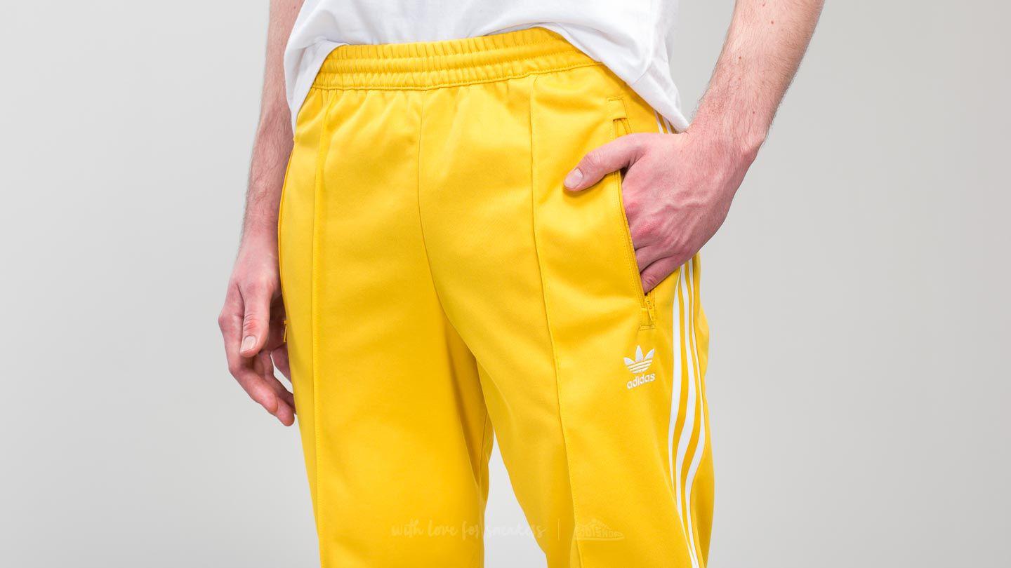 adidas beckenbauer pants yellow