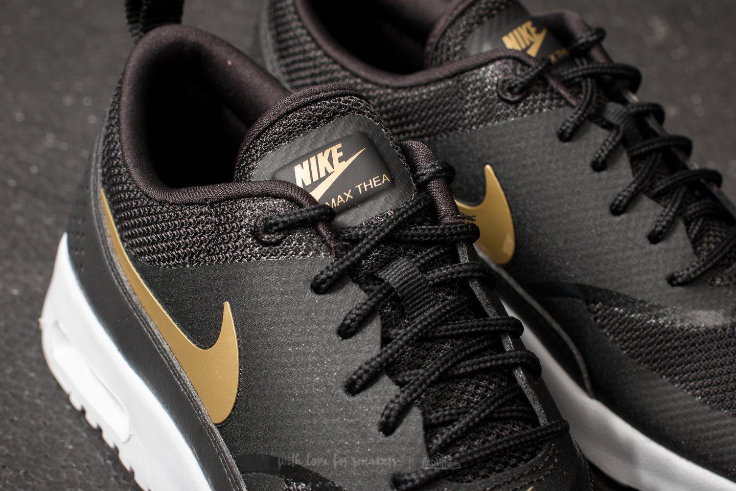 nike thea black and gold