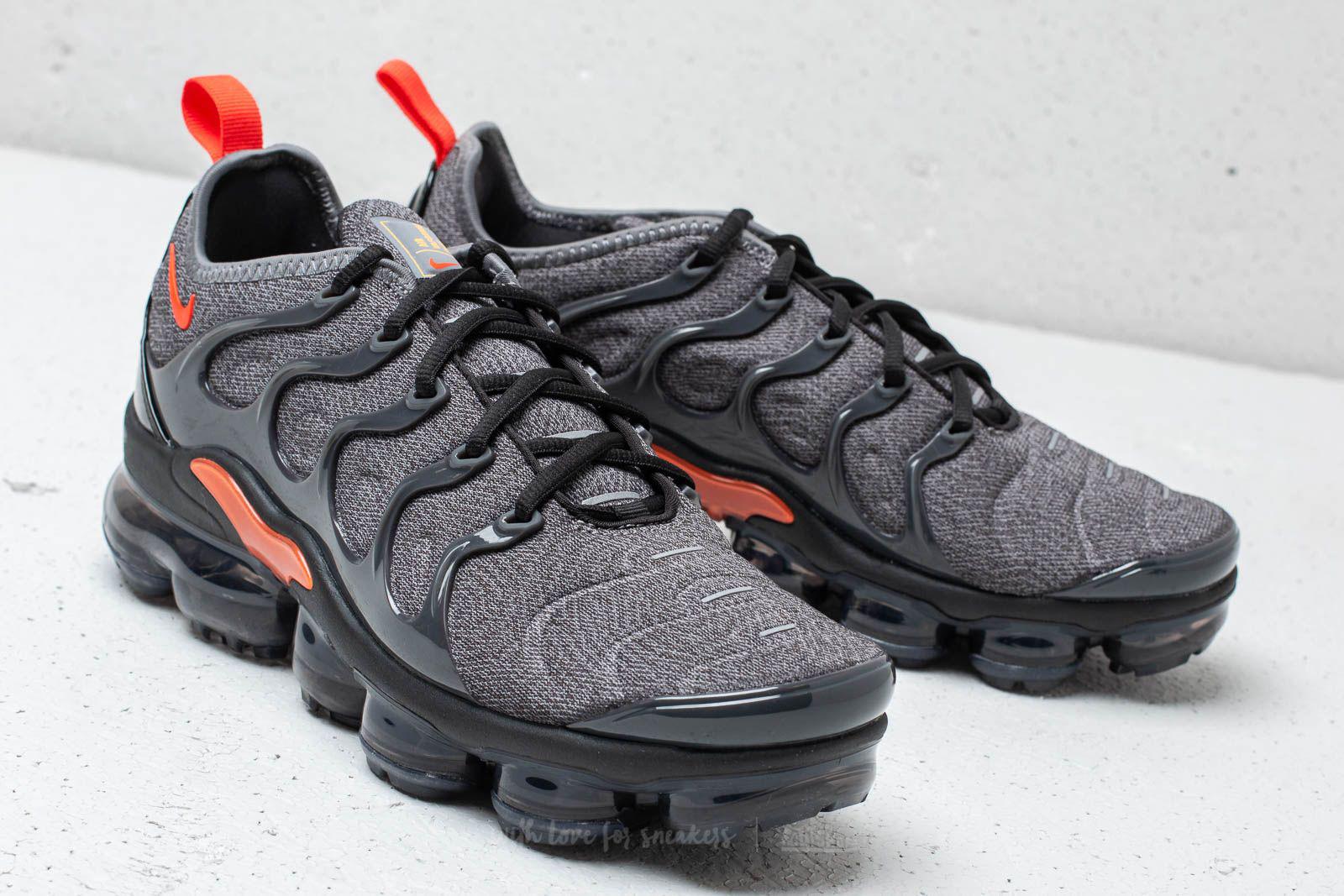 grey and orange vapormax plus