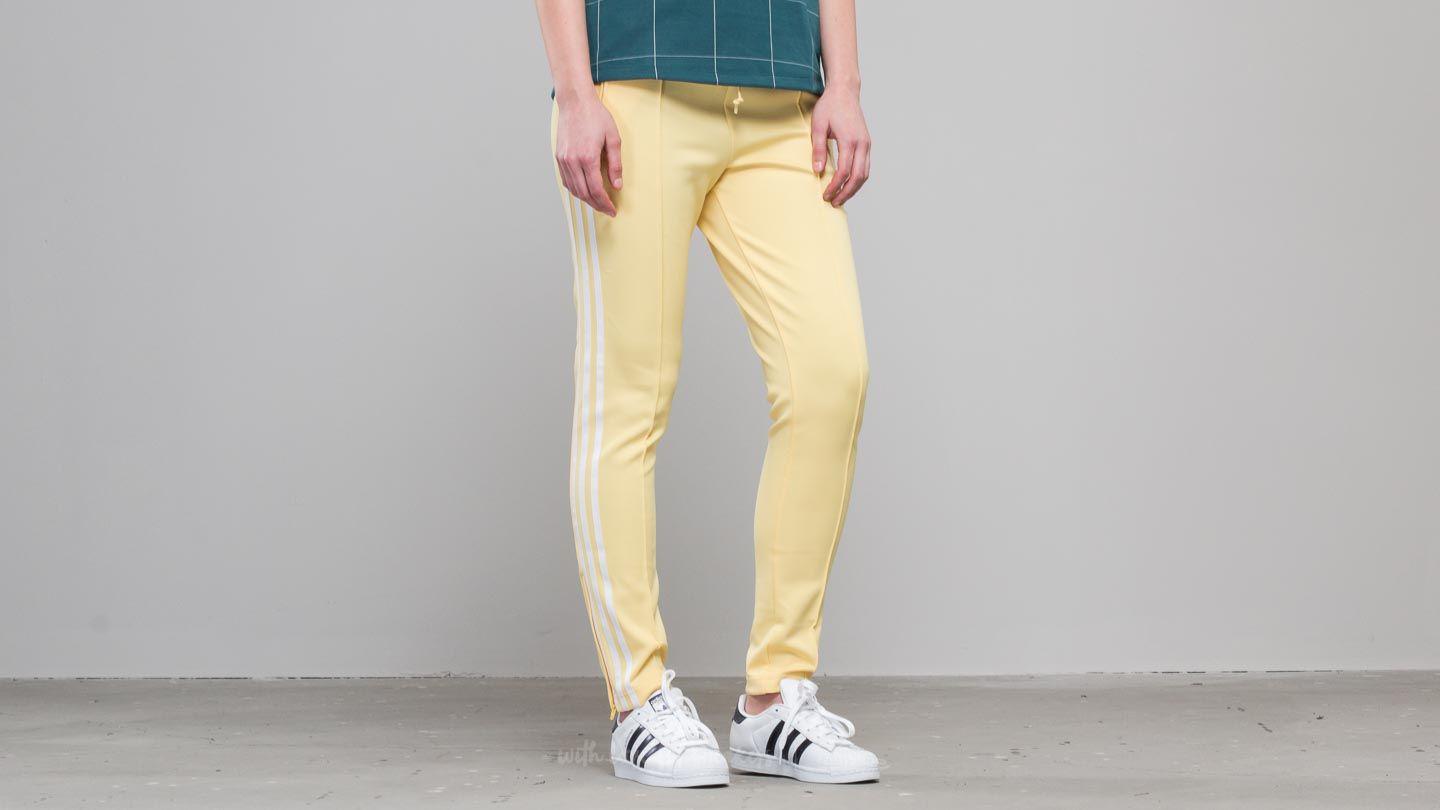 yellow adidas track pants