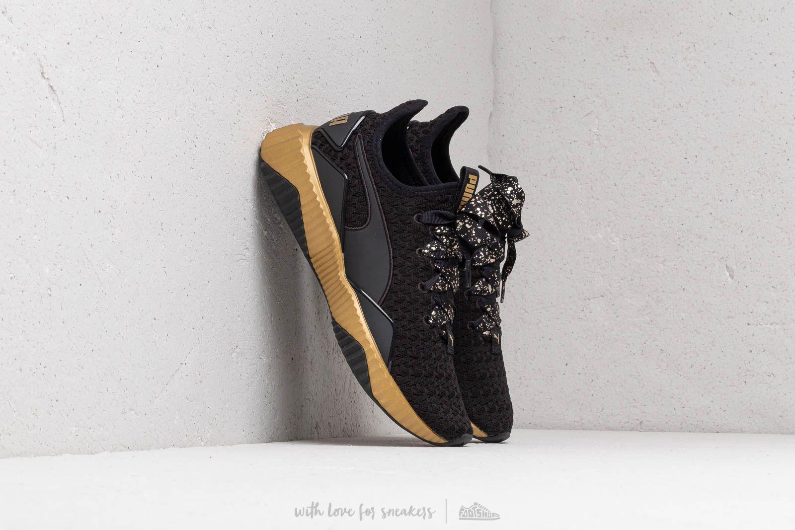 puma black team gold