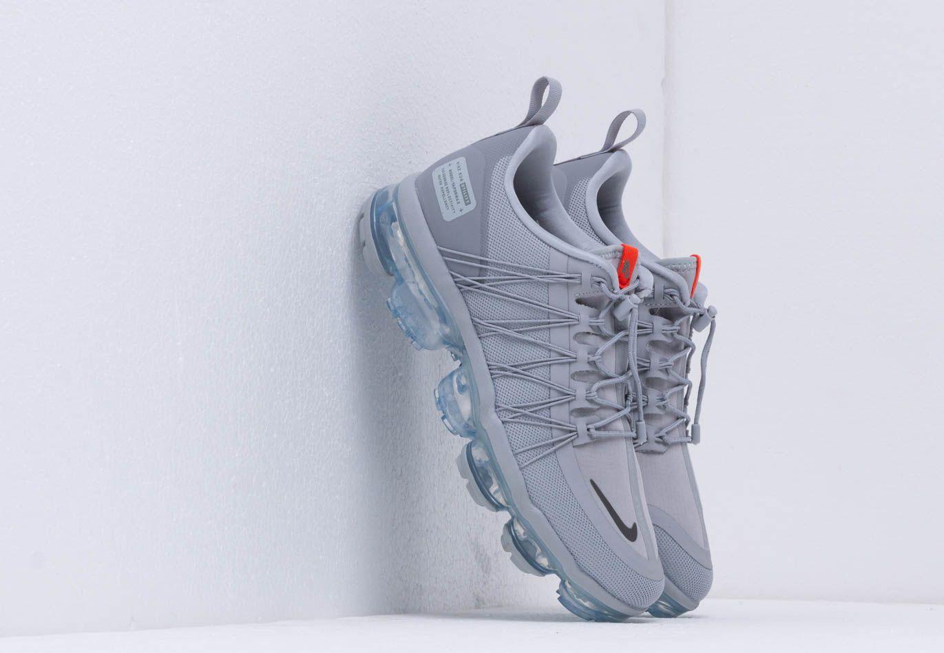 gray and orange vapormax