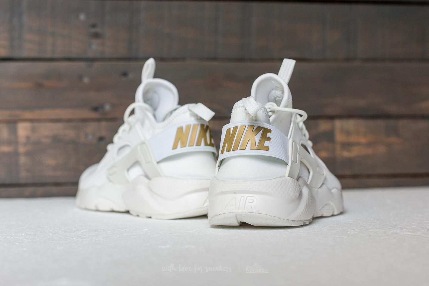 gold and white huaraches