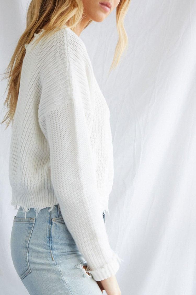 distressed white sweater