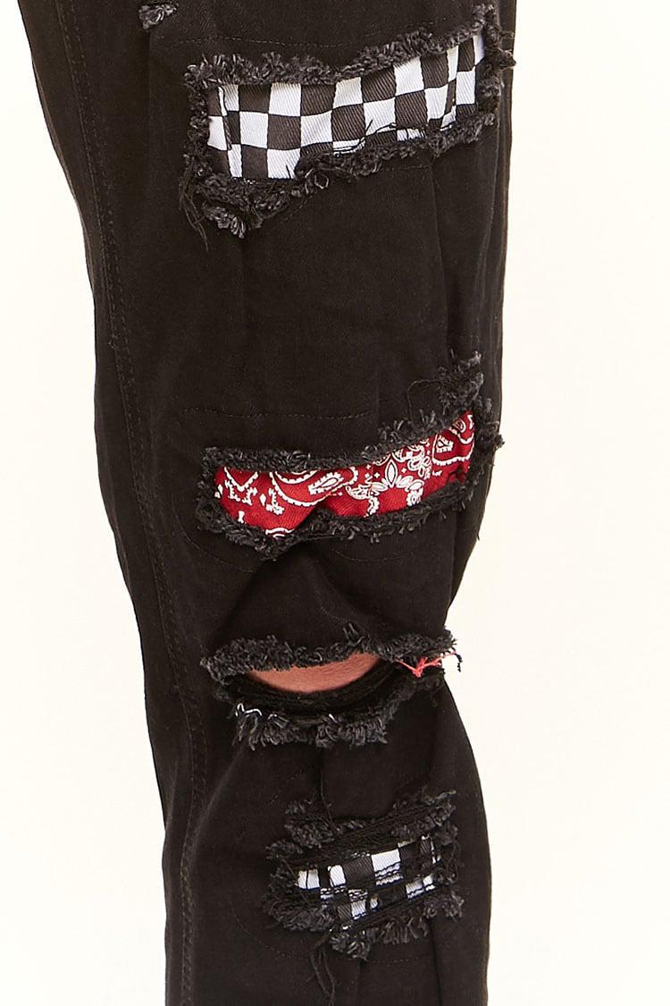 distressed patched jeans