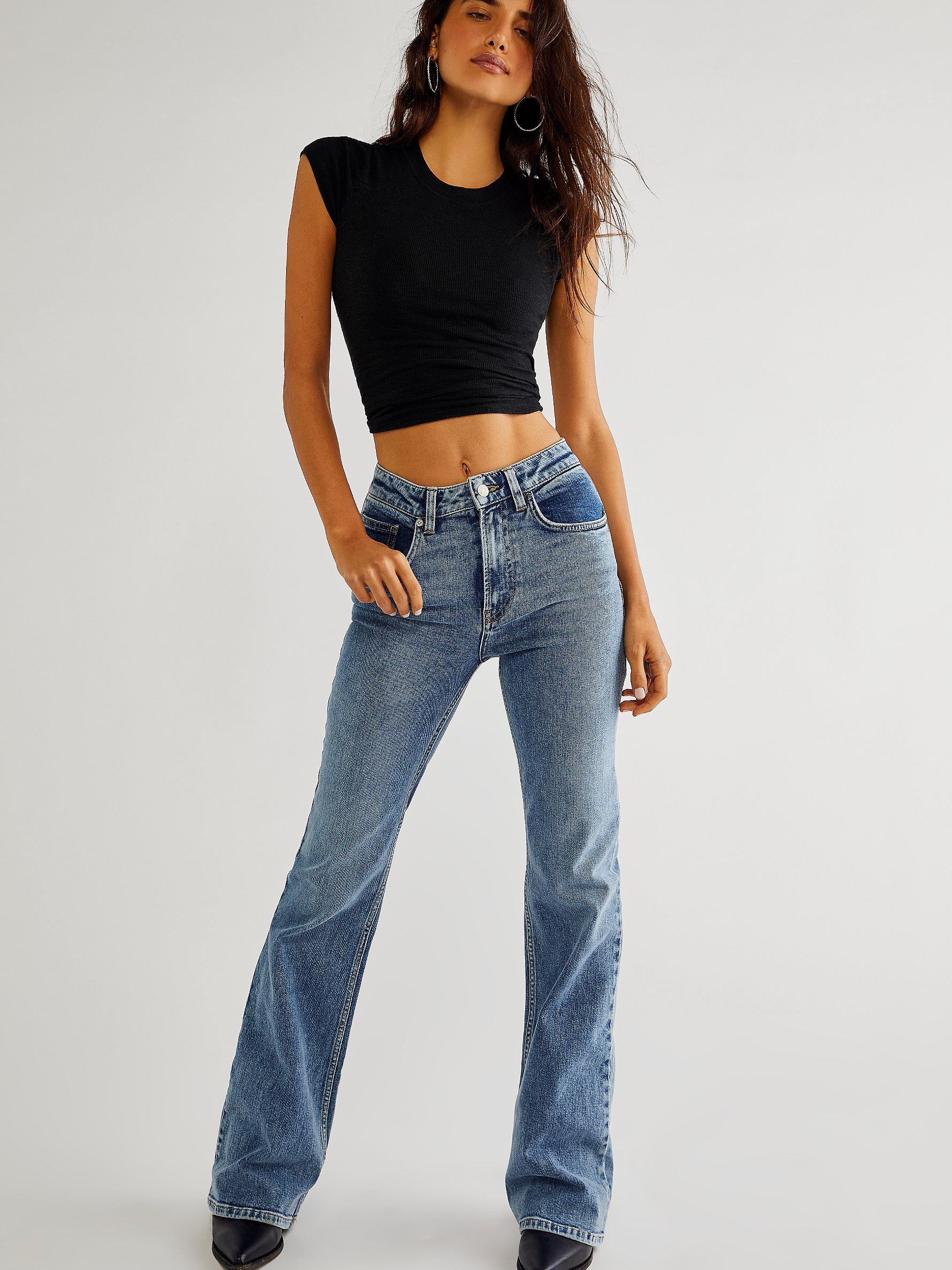 https://cdna.lystit.com/photos/freepeople/4a7741fe/free-people-Electric-Pink-Thunderbird-Flare-Jeans.jpeg
