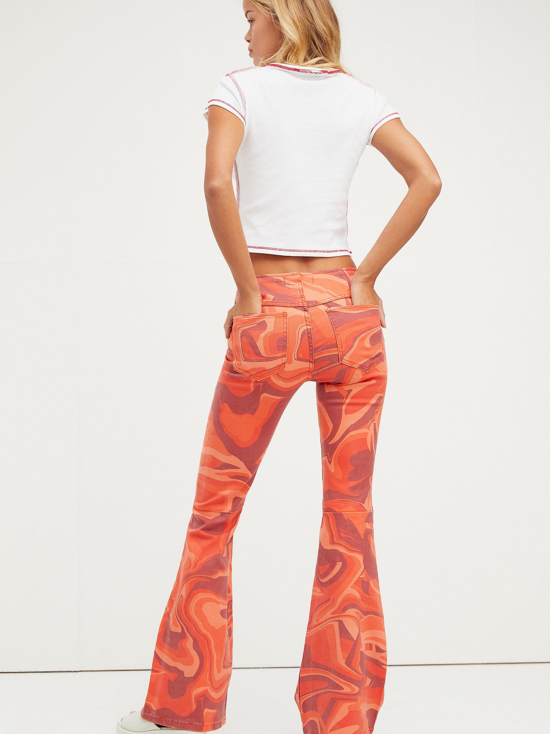 Free People Penny Pull-on Printed Flare Jeans in Red | Lyst