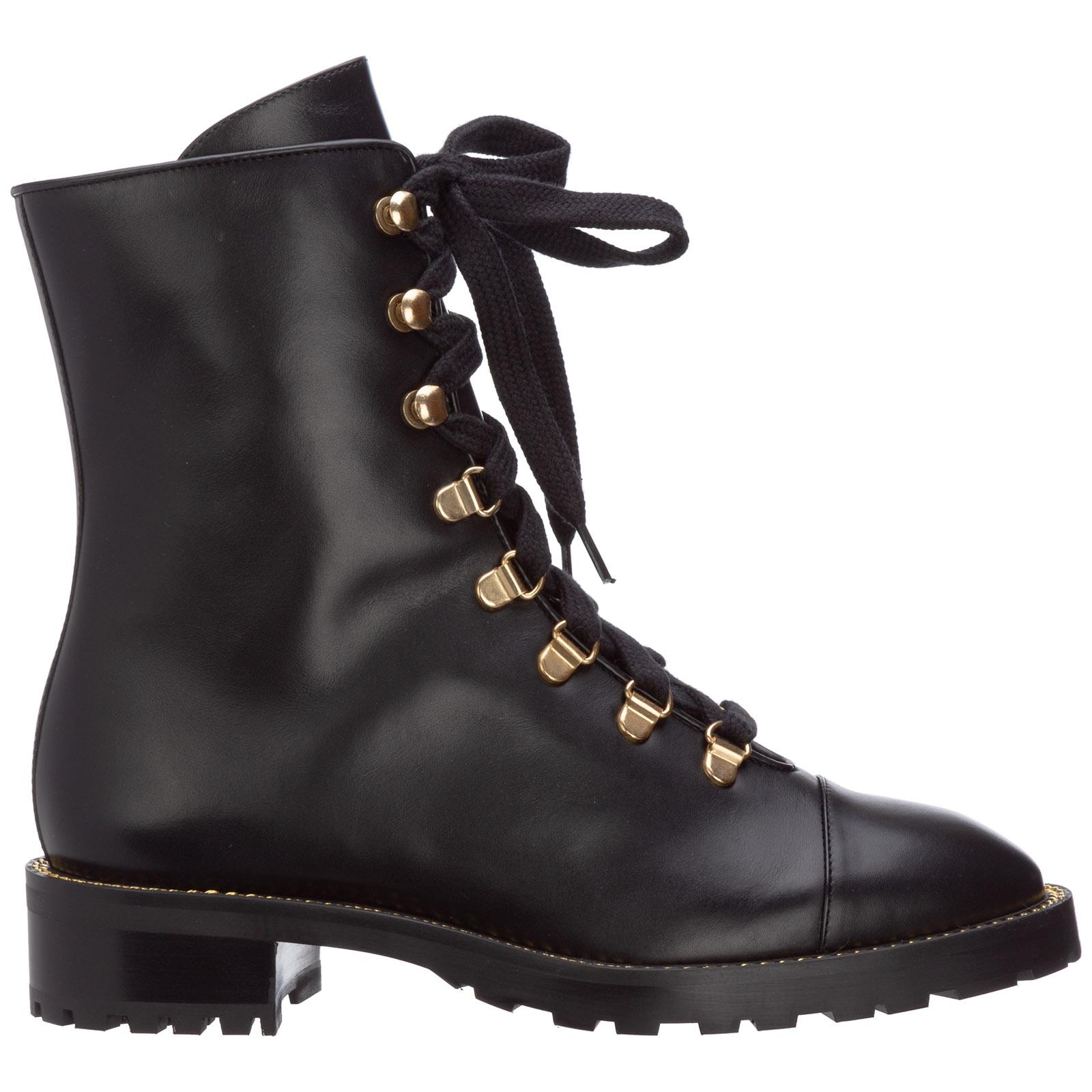 combat boots with gold accents