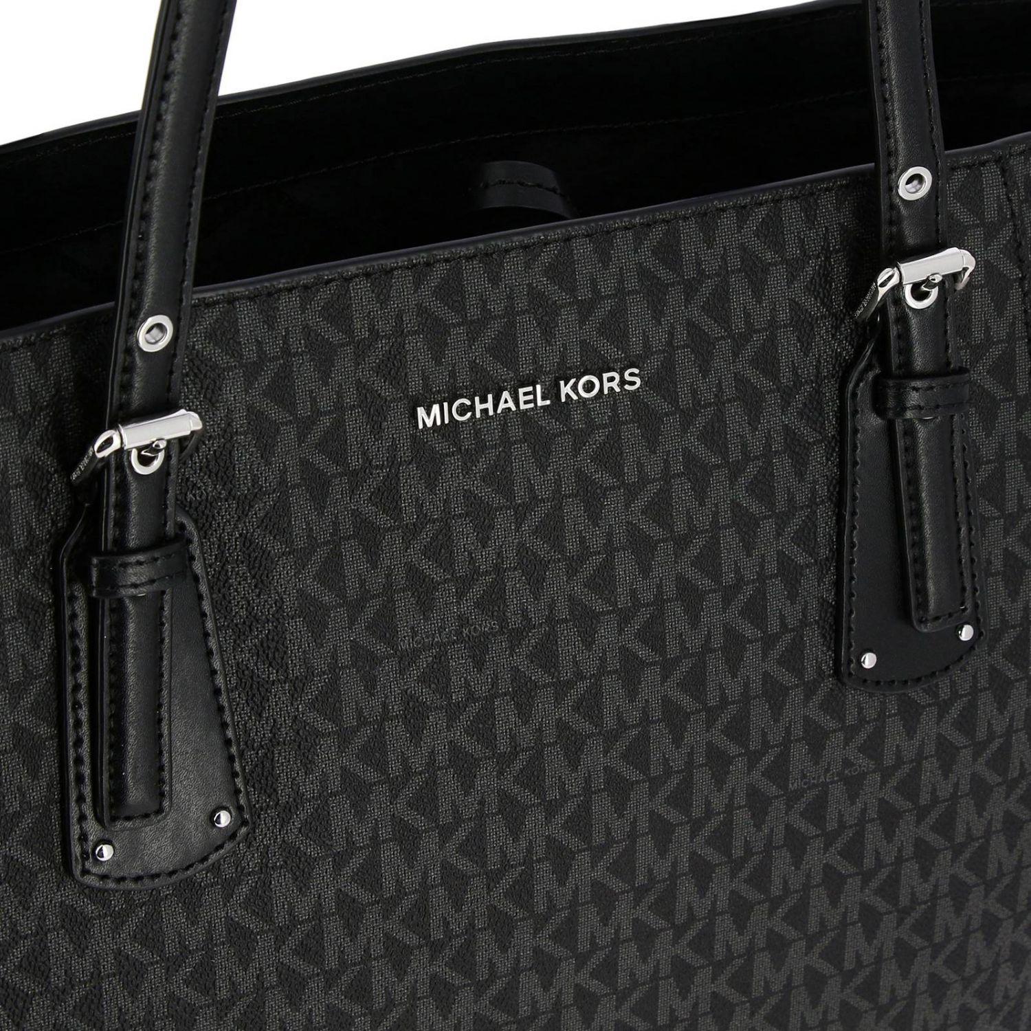 michael kors purse with mk all over it