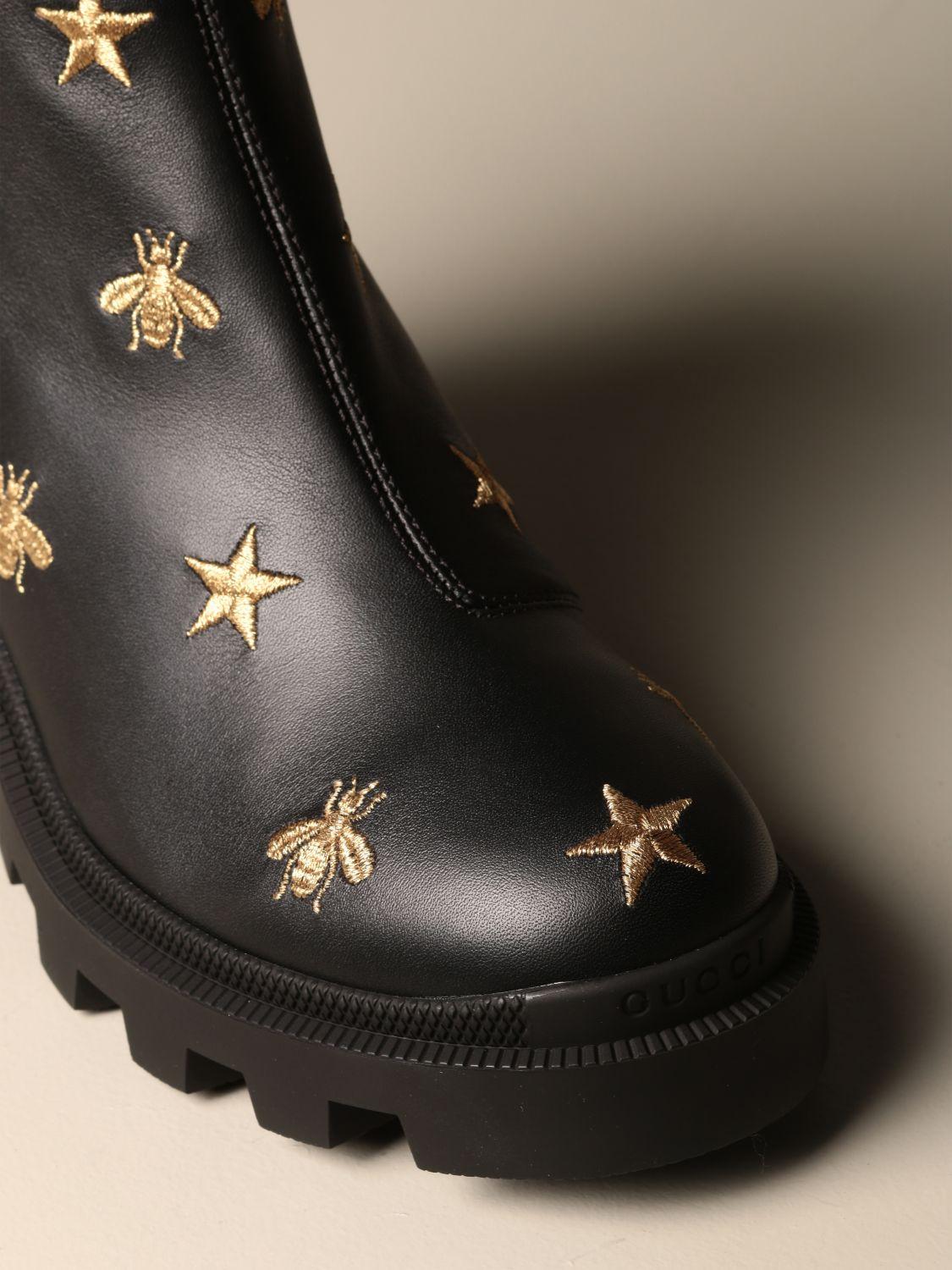 embroidered leather ankle boot with belt gucci