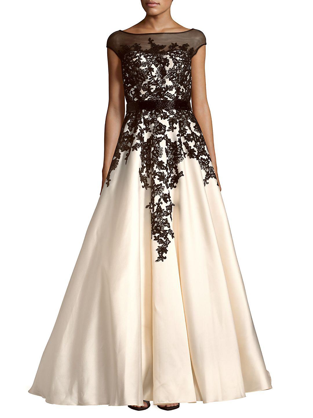 cream and black gown