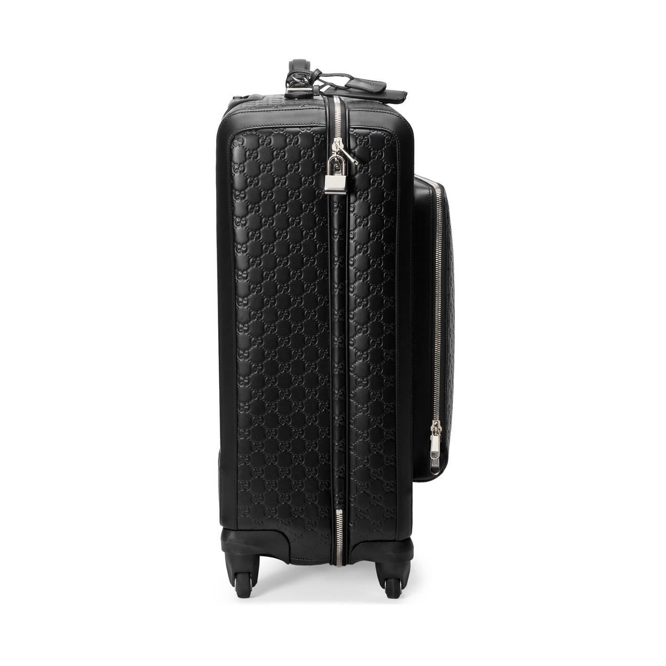 black gucci suitcase